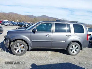 2014 Honda Pilot Touring with VIN 5FNYF4H95EB019048, listed as a IAAI auction lot 41526958 with 172,252 mi miles and . Bid and sale history available at DreamBid. Image 14.
