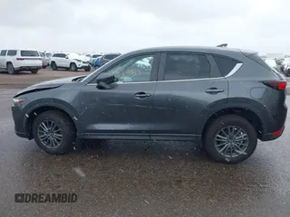 2021 Mazda CX-5 Touring with VIN JM3KFBCM8M0311433, listed as a IAAI auction lot 40554094 with 23,319 mi miles. Bid and sale history available at carsss.com. Image 14.