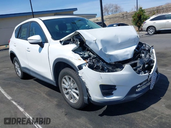 2016 Mazda CX-5 Sport with VIN JM3KE2BY9G0825285, listed as a IAAI auction lot 41841833 with 96,915 mi miles. Bid and sale history available at carsss.com. Image 1.