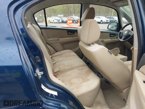 2011 Suzuki SX4 LE with VIN JS2YC5A23B6304713, listed as a IAAI auction lot 41997287 with 114,024 mi miles. Bid and sale history available at carsss.com. Image 8.