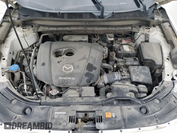 2020 Mazda CX-5 Touring z VIN JM3KFACM6L0787687, wystawiony jako Copart lot #57639555 z przebiegiem 91 219 mil mil oraz Szkoda całkowita • Salvage title. Historia ofert i sprzedaży dostępna na DreamBid. Obrazek 12.
