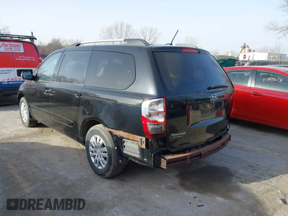 2011 Kia Sedona LX with VIN KNDMG4C70B6411556, listed as a IAAI auction lot 41768777 with 124,180 mi miles. Bid and sale history available at carsss.com. Image 3.