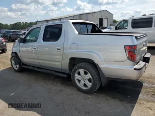 2014 Honda Ridgeline RTL with VIN 5FPYK1F57EB002835, listed as a Copart auction lot 54748905 with 111,253 mi miles and Salvage title. Bid and sale history available at DreamBid. Image 2.