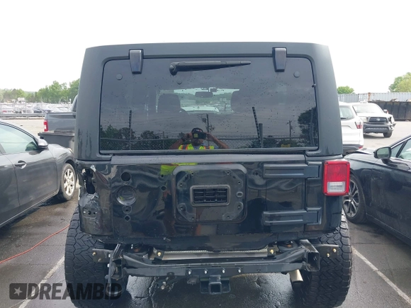 2015 Jeep Wrangler Unlimited Willys Wheeler with VIN 1C4BJWDG4FL687829, listed as a IAAI auction lot 42099147 with 98,969 mi miles and . Bid and sale history available at DreamBid. Image 6.
