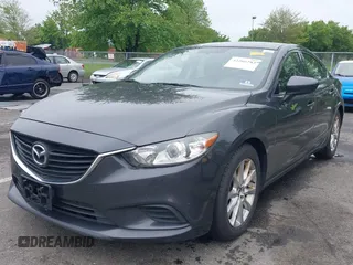 2014 Mazda 6 i Sport with VIN JM1GJ1U52E1102800, listed as a IAAI auction lot 42266283 with 103,886 mi miles and . Bid and sale history available at DreamBid. Image 2.