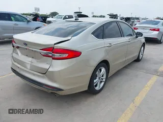 2018 Ford Fusion SE z VIN 3FA6P0H75JR176394, wystawiony jako IAAI lot #42169780 z przebiegiem 65 617 mil mil oraz . Historia ofert i sprzedaży dostępna na DreamBid. Obrazek 4.