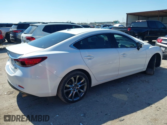 2016 Mazda 6 i Grand Touring with VIN JM1GJ1W57G1403028, listed as a IAAI auction lot 41591235 with 110,079 mi miles and . Bid and sale history available at carsss.com. Image 4.