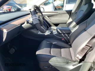 2024 Tesla Model Y with VIN 7SAYGDED3RF114643, listed as a Copart auction lot 56557075 with 3,021 mi miles and Salvage Title. Bid and sale history available at DreamBid. Image 7.