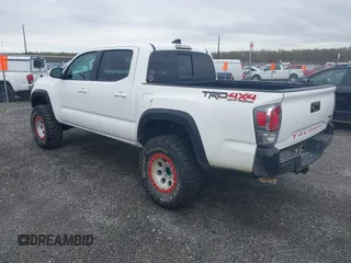 2023 Toyota Tacoma SR with VIN 3TMCZ5AN2PM641846, listed as a IAAI auction lot 41948660 with 21,969 mi miles and . Bid and sale history available at DreamBid. Image 3.