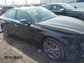 2015 Infiniti Q50 Premium with VIN JN1BV7AR1FM417499, listed as a IAAI auction lot 42063460 with 117,210 mi miles. Bid and sale history available at carsss.com. Image 14.