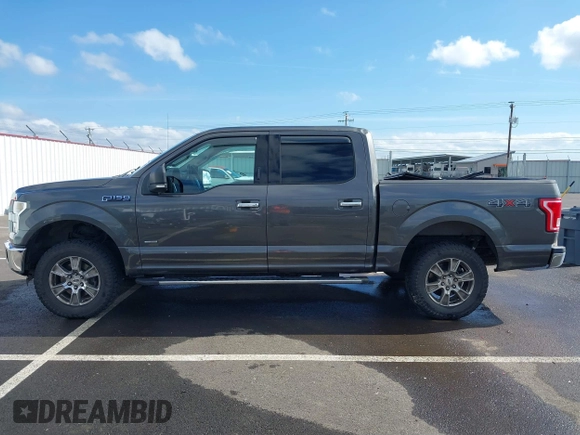 2015 Ford F-150 XLT with VIN 1FTEW1EG1FKE89277, listed as a IAAI auction lot 41752106 with 142,069 mi miles. Bid and sale history available at carsss.com. Image 14.