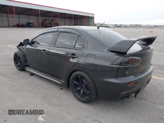 2013 Mitsubishi Lancer Evolution GSR with VIN JA32W8FV8DU012080, listed as a IAAI auction lot 41379744 with 95,070 mi miles. Bid and sale history available at carsss.com. Image 3.