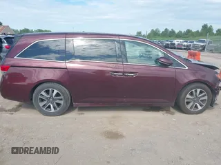 2014 Honda Odyssey Touring with VIN 5FNRL5H90EB120999, listed as a IAAI auction lot 42541370 with 96,454 mi miles and . Bid and sale history available at DreamBid. Image 14.