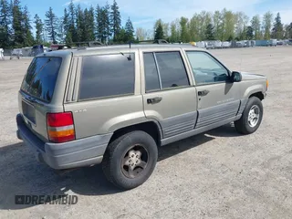 1997 Jeep Grand Cherokee Laredo with VIN 1J4GZ58S5VC500257, listed as a IAAI auction lot 41996034 with 222,513 mi miles and . Bid and sale history available at DreamBid. Image 4.
