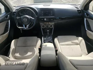 2014 Mazda CX-5 Sport with VIN JM3KE2BE9E0344990, listed as a Copart auction lot 59014145 with 126,905 mi miles and Salvage title. Bid and sale history available at DreamBid. Image 8.