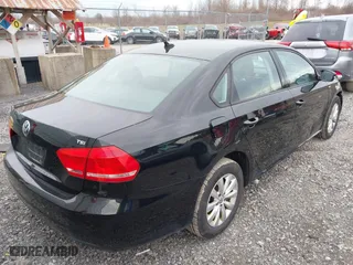 2014 Volkswagen Passat Wolfsburg Ed with VIN 1VWAT7A31EC098634, listed as a IAAI auction lot 41924146 with 80,872 mi miles. Bid and sale history available at carsss.com. Image 4.