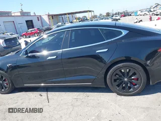 2017 Tesla Model S 100D with VIN 5YJSA1E21HF202591, listed as a IAAI auction lot 41983073 with 140,282 mi miles and . Bid and sale history available at DreamBid. Image 14.