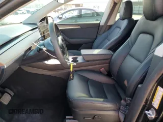 2024 Tesla Model Y Long Range с VIN 7SAYGDEE8RA231933, выставлен на аукционе Copart как лот 58078115 с пробегом 14 959 миль миль и Списание • Salvage title. История ставок и продаж доступна на DreamBid. Изображение 7.