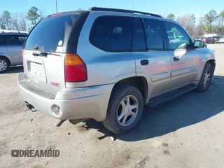2004 GMC Envoy SLE with VIN 1GKDT13S642213710, listed as a IAAI auction lot 41680656 with 239,187 mi miles. Bid and sale history available at carsss.com. Image 4.