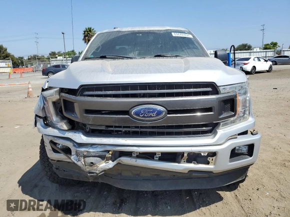 2018 Ford F-150 XL with VIN 1FTEW1CGXJFB40297, listed as a Copart auction lot 69642404 with 92,561 mi miles and Salvage title. Bid and sale history available at DreamBid. Image 5.