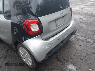 2016 Smart fortwo Passion z VIN WMEFJ5DA3GK055906, wystawiony jako IAAI lot #42274280 z przebiegiem 29 070 mil mil oraz . Historia ofert i sprzedaży dostępna na DreamBid. Obrazek 6.