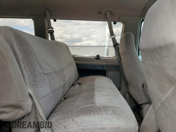 1992 Ford Econoline Wagon Super Custom z VIN 1FBJS31H3NHB08839, wystawiony jako Copart lot #55049275 z przebiegiem 158 054 mil mil oraz Szkody całkowita. Historia ofert i sprzedaży dostępna na DreamBid. Obrazek 11.
