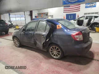 2011 Suzuki SX4 LE with VIN JS2YC5A20B6304734, listed as a Copart auction lot 87377154 with 190,761 mi miles and Salvage Title. Bid and sale history available at carsss.com. Image 2.