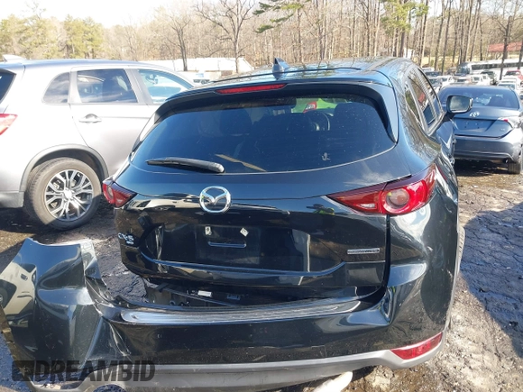2021 Mazda CX-5 Touring with VIN JM3KFBCM9M0483082, listed as a IAAI auction lot 41305127 with 42,926 mi miles. Bid and sale history available at carsss.com. Image 16.
