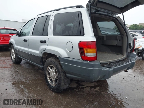 2004 Jeep Grand Cherokee Laredo z VIN 1J4GW48S64C132172, wystawiony jako IAAI lot #42163524 z przebiegiem 170 952 mil mil oraz . Historia ofert i sprzedaży dostępna na DreamBid. Obrazek 3.