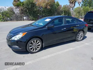 2012 Hyundai Sonata SE z VIN 5NPEC4AC6CH387870, wystawiony jako IAAI lot #42399483 z przebiegiem 151 289 mil mil oraz . Historia ofert i sprzedaży dostępna na DreamBid. Obrazek 2.
