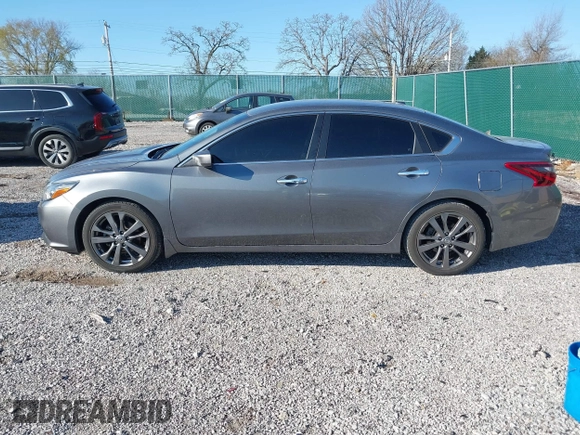 2018 Nissan Altima 2.5 SR with VIN 1N4AL3AP7JC240029, listed as a IAAI auction lot 41883209 with 77,190 mi miles. Bid and sale history available at carsss.com. Image 14.