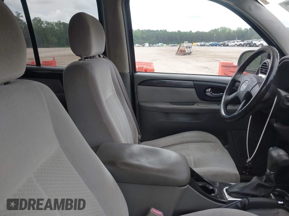 2007 GMC Envoy SLE with VIN 1GKDS13S572174308, listed as a IAAI auction lot 42211372 with 212,377 mi miles and . Bid and sale history available at DreamBid. Image 5.