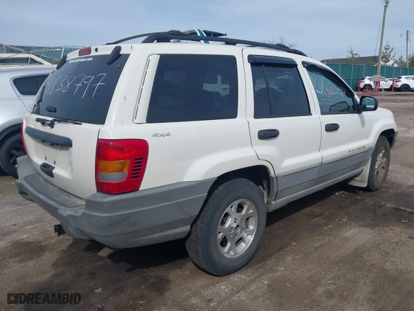 1999 Jeep Grand Cherokee Laredo with VIN 1J4GW58SXXC623404, listed as a IAAI auction lot 41838797 with 0 mi miles. Bid and sale history available at carsss.com. Image 4.