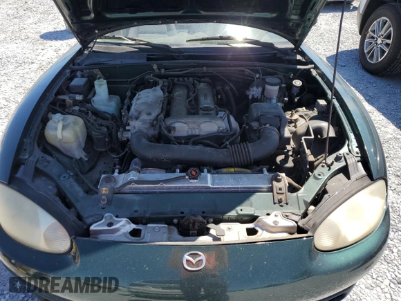 1999 Mazda MX-5 Miata with VIN JM1NB3530X0118452, listed as a Copart auction lot 53337575 with 150,574 mi miles and Clean title. Bid and sale history available at DreamBid. Image 11.
