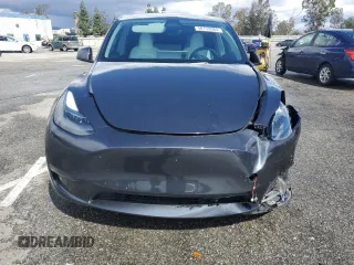 2024 Tesla Model Y z VIN 7SAYGDED1RF089192, wystawiony jako Copart lot #48752085 z przebiegiem 7 643 mil mil oraz Szkoda całkowita • Salvage title. Historia ofert i sprzedaży dostępna na DreamBid. Obrazek 5.