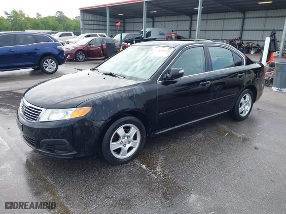 2010 Kia Optima LX with VIN KNAGG4A85A5375227, listed as a IAAI auction lot 42019118 with 221,324 mi miles. Bid and sale history available at carsss.com. Image 2.