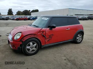 2009 MINI Hardtop with VIN WMWMF33519TW77558, listed as a Copart auction lot 54556785 with 97,749 mi miles and Salvage Title. Bid and sale history available at DreamBid. Image 1.