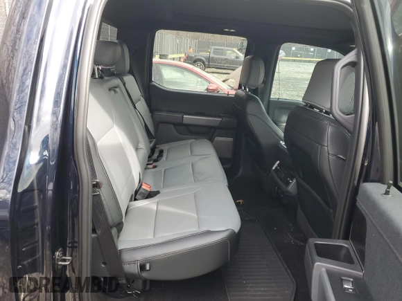 2023 Ford F-150 Lightning Pro z VIN 1FT6W1EV2PWG06829, wystawiony jako Copart lot #45875915 z przebiegiem 30 021 mil mil oraz Szkoda całkowita • Salvage title. Historia ofert i sprzedaży dostępna na DreamBid. Obrazek 11.