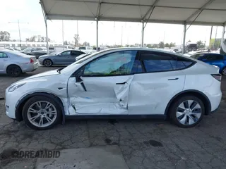2023 Tesla Model Y Long Range with VIN 7SAYGAEE7PF607195, listed as a IAAI auction lot 41819147 with 74,694 mi miles. Bid and sale history available at carsss.com. Image 14.