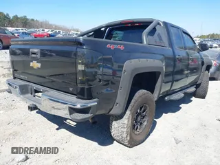 2014 Chevrolet Silverado 1500 LT with VIN 1GCVKREH3EZ320659, listed as a IAAI auction lot 41665352 with 105,574 mi miles and . Bid and sale history available at DreamBid. Image 4.