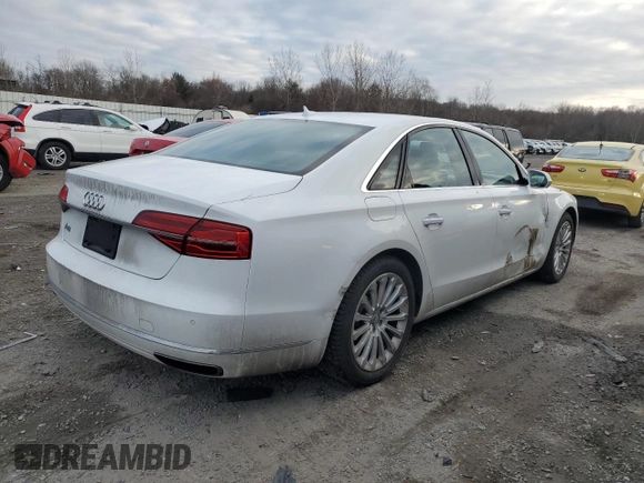 2015 Audi A8 z VIN WAUJGAFD9FN003570, wystawiony jako Copart lot #87642905 z przebiegiem 71 523 mil mil oraz Czysty tytuł • Clean title. Historia ofert i sprzedaży dostępna na DreamBid. Obrazek 3.