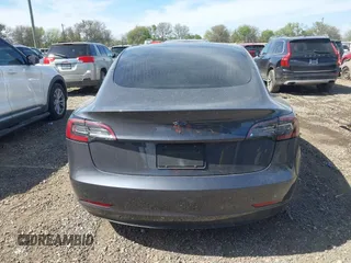 2019 Tesla Model 3 Mid Range with VIN 5YJ3E1EA5KF327679, listed as a IAAI auction lot 41804379 with 87,208 mi miles and . Bid and sale history available at DreamBid. Image 16.