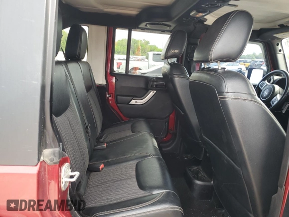 2013 Jeep Wrangler Unlimited Freedom z VIN 1C4BJWDG7DL582764, wystawiony jako Copart lot #54133275 z przebiegiem 183 507 mil mil oraz Szkoda całkowita • Salvage title. Historia ofert i sprzedaży dostępna na DreamBid. Obrazek 11.