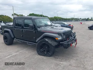 2021 Jeep Gladiator Rubicon z VIN 1C6JJTBG6ML622904, wystawiony jako IAAI lot #42167412 z przebiegiem 21 889 mil mil oraz . Historia ofert i sprzedaży dostępna na DreamBid. Obrazek 1.