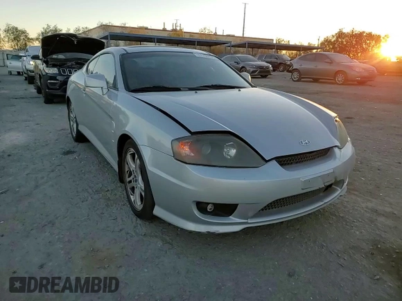 2005 Hyundai Tiburon GT z VIN KMHHN65F05U171038, wystawiony jako Copart lot #87765735 z przebiegiem 113 129 mil mil oraz Szkoda całkowita • Salvage title. Historia ofert i sprzedaży dostępna na DreamBid. Obrazek 11.