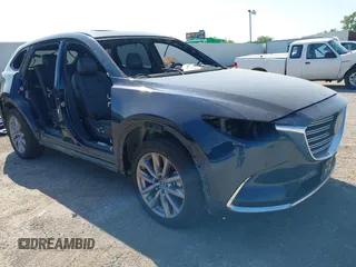 2023 Mazda CX-9 Carbon Edition with VIN JM3TCBDY0P0634703, listed as a IAAI auction lot 42355302 with 36,753 mi miles and . Bid and sale history available at DreamBid. Image 1.