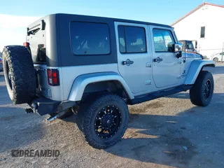 2010 Jeep Wrangler Unlimited Sahara with VIN 1J4BA5H14AL230604, listed as a IAAI auction lot 41884346 with 97,060 mi miles. Bid and sale history available at carsss.com. Image 4.