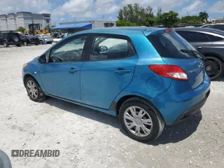 2011 Mazda 2 Sport with VIN JM1DE1HY0B0122590, listed as a Copart auction lot 56162515 with 140,847 mi miles and Clean Title. Bid and sale history available at DreamBid. Image 2.