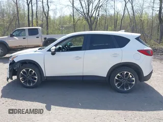 2016 Mazda CX-5 Grand Touring with VIN JM3KE4DY0G0632693, listed as a IAAI auction lot 42123142 with 106,592 mi miles. Bid and sale history available at carsss.com. Image 14.