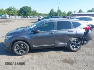2018 Honda CR-V Touring z VIN 5J6RW2H93JL004834, wystawiony jako IAAI lot #42351364 z przebiegiem 63 746 mil mil oraz . Historia ofert i sprzedaży dostępna na DreamBid. Obrazek 14.